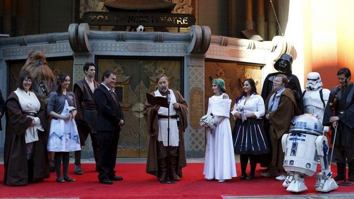 Andrew Porters and Caroline Ritter from Australia attend their wedding ceremony accompanied by people dressed as characters from Star Wars December 17, 2015. REUTERS/Mario Anzuoni