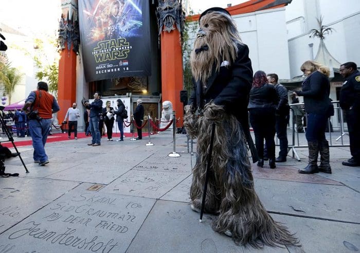 Anthony Troli, dressed as the character of Chewbacca, waits before a Star Wars themed wedding in the forecourt of the TCL Chinese Theatre in Hollywood, California December 17, 2015. REUTERS/Mario Anzuoni