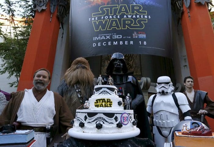 People dressed as characters from Star Wars stand behind a wedding cake December 17, 2015. REUTERS/Mario Anzuoni