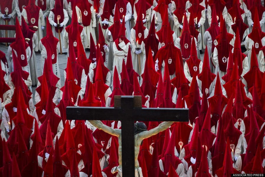 Penitents take part in the "Procesion del Silencio" by the "Cristo de las Injurias" brotherhood, during the Holy Week in Zamora, Spain, Wednesday, April 16, 2014. Hundreds of processions take place throughout Spain during the Easter Holy Week. (AP Photo/Andres Kudacki)