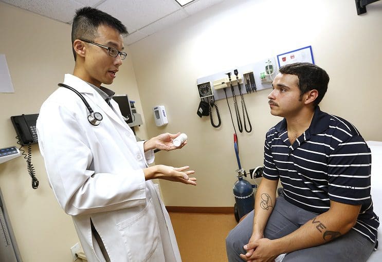 06/23/15 /LOS ANGELES/ Bryan Fiallos (R) visits with Dr. Kevin Liao, Staff Physician- HIV from the AltaMed in East Los Angeles, to discuss his daily pill, Truvada, a daily pill that helps prevent HIV in high-risk groups. The daily pill, Truvada, shows it can effectively protect gay men against infection with HIV. (Photo by Aurelia Ventura/La Opinion)