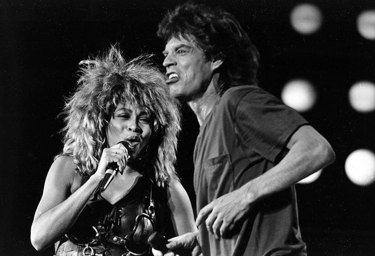 Tina Turner, left, and Mick Jagger perform together at the Live Aid concert at Philadelphia's J.F.K. Stadium, on July 13, 1985. (AP Photo/Rusty Kennedy)