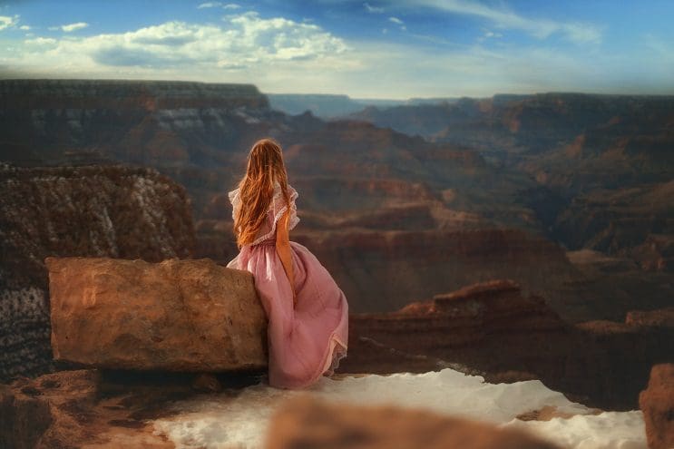 grand-canyon-sitting-on-rock-facing-oug
